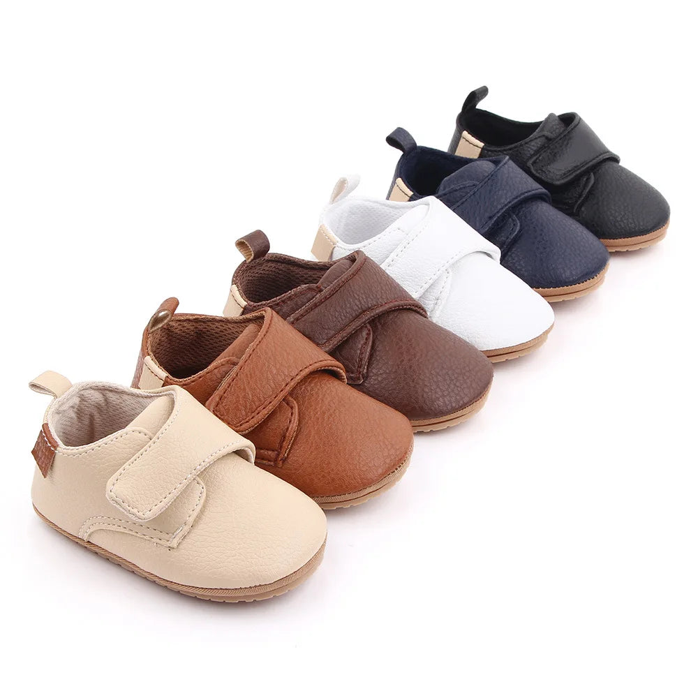Bubebaby BabyLove faux leather dress shoes in a classic look. The shoes feature a sleek, polished design perfect for special occasions or formal wear. With a soft, cushioned interior for comfort