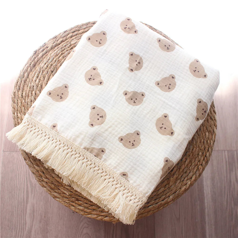 Nursery Muslin Throw Bears at BubeBaby. This unisex throw is made from soft, breathable cotton muslin, perfect for babies. Ideal for snuggling and keeping cozy, it’s designed for comfort and style. Shop now for a versatile, high-quality addition to your nursery essentials