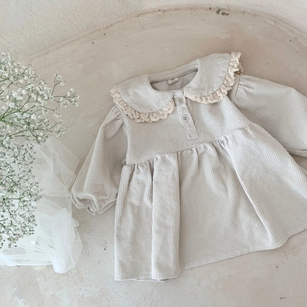 BabyLove Corduroy Peter Pan Collar Dress - A charming baby dress made from soft corduroy fabric, featuring a classic Peter Pan collar and delicate detailing, perfect for special occasions or everyday wear