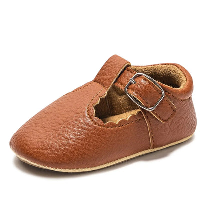 Bubebaby BabyLove faux leather dress shoes in a classic look. The shoes feature a sleek, polished design perfect for special occasions or formal wear. With a soft, cushioned interior for comfort