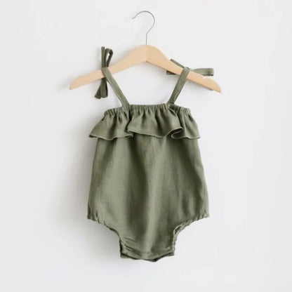 Shop the BabyLove Summer Romper at BubeBaby! A sleeveless, solid-colored romper with a ruffled bust . Made from 100% cotton, it's available for ages 0-24 months. Fits true to size and is perfect for summer. Choose the right size based on age and measurements for a comfortable fit