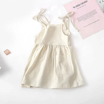 A BabyLove by Bubebaby light and breezy summer dress with spaghetti straps, designed for babies. The dress features a loose, relaxed fit and a soft, comfortable fabric, perfect for keeping little ones cool on warm days