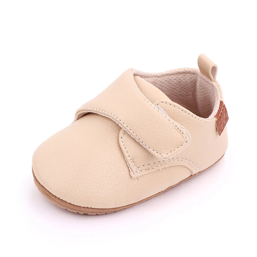 Bubebaby BabyLove faux leather dress shoes in a classic look. The shoes feature a sleek, polished design perfect for special occasions or formal wear. With a soft, cushioned interior for comfort