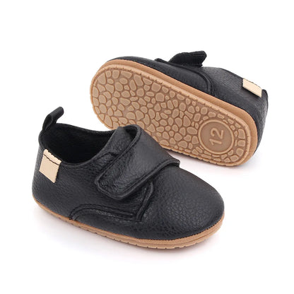Bubebaby BabyLove faux leather dress shoes in a classic look. The shoes feature a sleek, polished design perfect for special occasions or formal wear. With a soft, cushioned interior for comfort