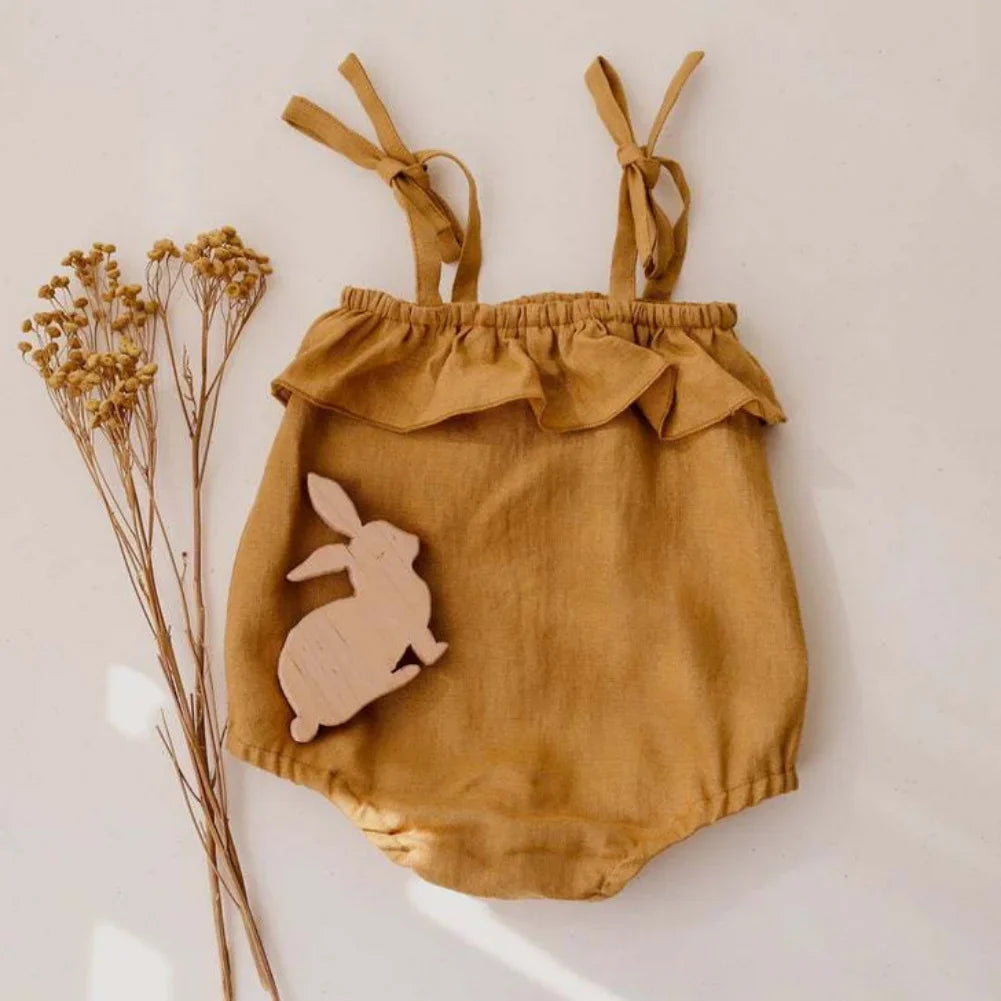 Shop the BabyLove Summer Romper at BubeBaby! A sleeveless, solid-colored romper with a ruffled bust . Made from 100% cotton, it's available for ages 0-24 months. Fits true to size and is perfect for summer. Choose the right size based on age and measurements for a comfortable fit