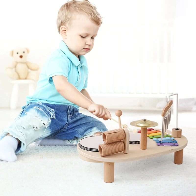 Discover the Bubebaby Montessori Music Table, an educational and non-electric musical instrument designed for children ages 0-14+. This table features engaging musical elements. Lightweight at 1.23kg and measuring 41.2X24.7X9.5cm, it's perfect for young learners seeking fun and educational play