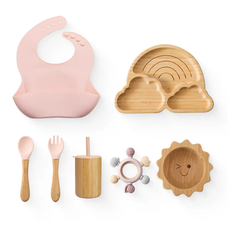 Eco-friendly Bubebaby Babylove 6-piece/7-piece Bamboo and Silicone Dinnerware Set for babies aged 6 months to 6 years. Made from BPA-free silicone and bamboo wood, this set includes a bowl, plate, fork, spoon, and teething toys, providing a safe and healthy mealtime experience. Certified by CE, EU, CIQ, and other standards for safety and quality
