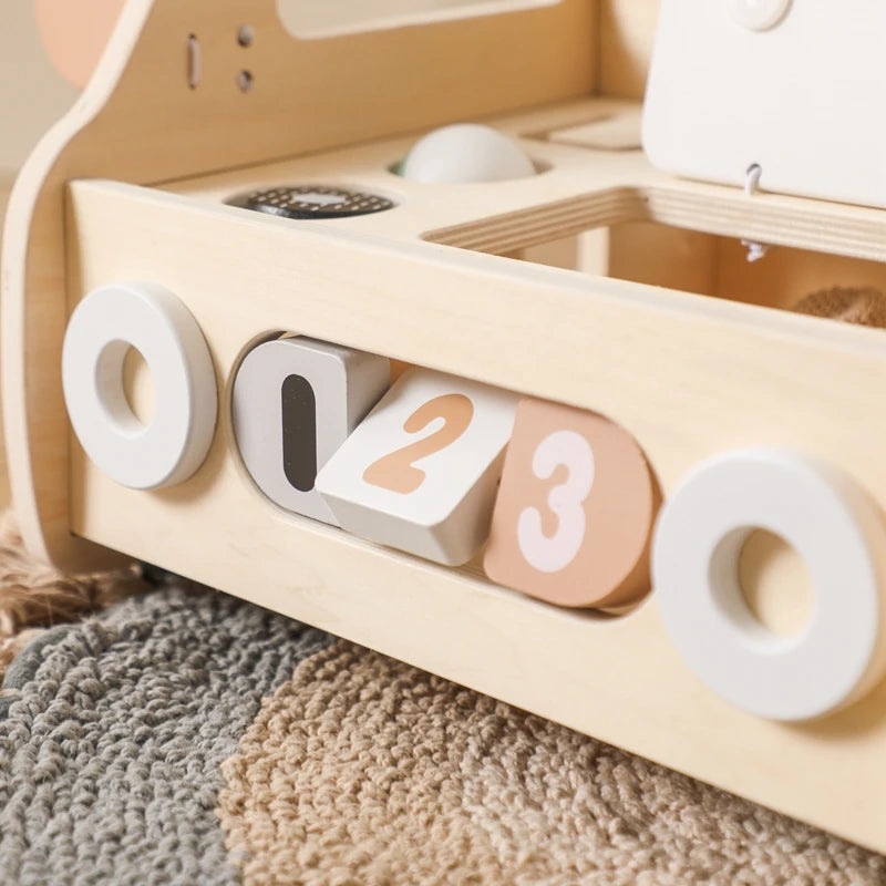 Spinning number blocks on the side of the wooden push walker