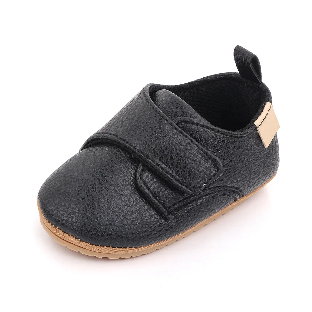 Bubebaby BabyLove faux leather dress shoes in a classic look. The shoes feature a sleek, polished design perfect for special occasions or formal wear. With a soft, cushioned interior for comfort