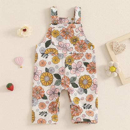 Bubebaby BabyLove Floral Jumpsuit Dungaree Romper. The romper features a floral pattern with a mix of vibrant colors. Featuring a pocket on the chest with shoulder straps, and snap closures at the bottom for easy diaper changes.
