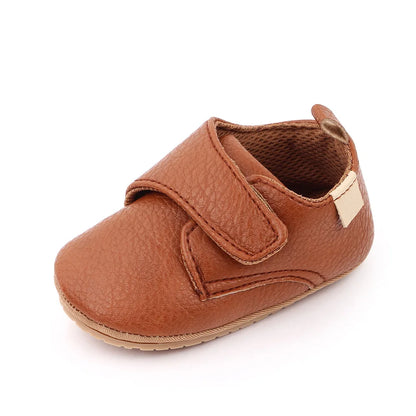 Bubebaby BabyLove faux leather dress shoes in a classic look. The shoes feature a sleek, polished design perfect for special occasions or formal wear. With a soft, cushioned interior for comfort