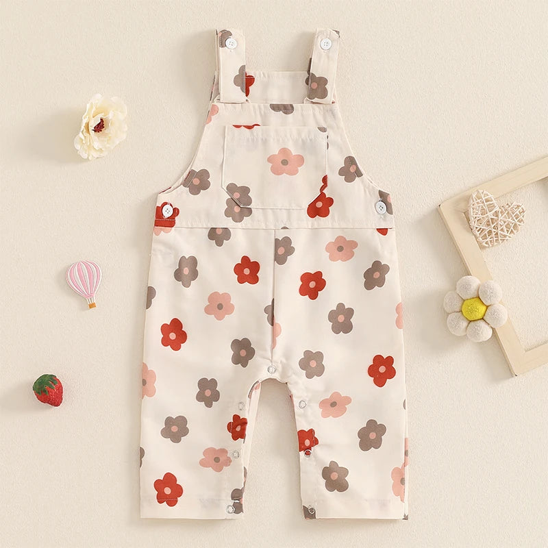 Bubebaby BabyLove Floral Jumpsuit Dungaree Romper. The romper features a floral pattern with a mix of vibrant colors. Featuring a pocket on the chest with shoulder straps, and snap closures at the bottom for easy diaper changes.