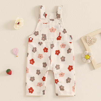 Bubebaby BabyLove Floral Jumpsuit Dungaree Romper. The romper features a floral pattern with a mix of vibrant colors. Featuring a pocket on the chest with shoulder straps, and snap closures at the bottom for easy diaper changes.