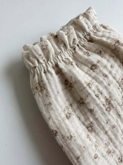 Soft muslin pants for babies from the BabyLove by Bubebaby collection. The pants are made of lightweight, breathable fabric with a gentle, stretchy waistband and a relaxed fit for comfort. The color is a soft, neutral tone, suitable for pairing with various baby tops