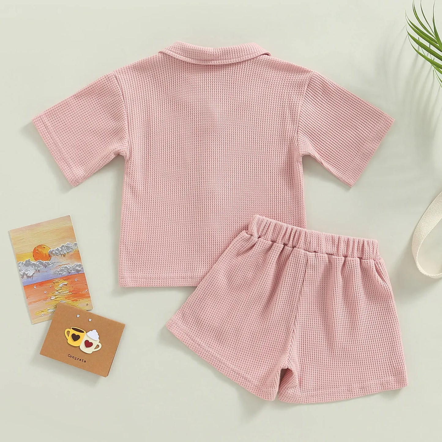 Shop our Bubebaby BabyLove summer baby unisex sets made from cotton and polyester, featuring a V-neck, single-breasted closure, and short sleeves. Available for ages 0-4 years with sizes ranging from 80-120 cm. The set includes a top and shorts with a cute print pattern, fitting true to size. Ideal for warm weather, these sets ensure comfort and style for your little ones.