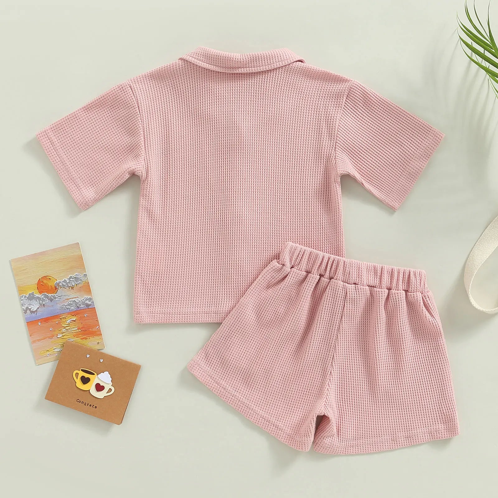 Shop our Bubebaby BabyLove summer baby unisex sets made from cotton and polyester, featuring a V-neck, single-breasted closure, and short sleeves. Available for ages 0-4 years with sizes ranging from 80-120 cm. The set includes a top and shorts with a cute print pattern, fitting true to size. Ideal for warm weather, these sets ensure comfort and style for your little ones.