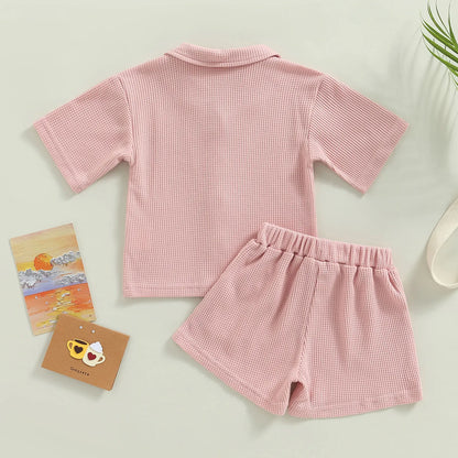 Shop our Bubebaby BabyLove summer baby unisex sets made from cotton and polyester, featuring a V-neck, single-breasted closure, and short sleeves. Available for ages 0-4 years with sizes ranging from 80-120 cm. The set includes a top and shorts with a cute print pattern, fitting true to size. Ideal for warm weather, these sets ensure comfort and style for your little ones.