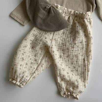 Soft muslin pants for babies from the BabyLove by Bubebaby collection. The pants are made of lightweight, breathable fabric with a gentle, stretchy waistband and a relaxed fit for comfort. The color is a soft, neutral tone, suitable for pairing with various baby tops