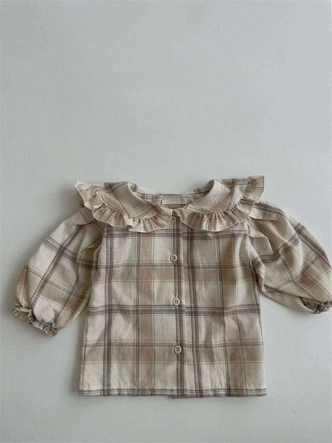 BabyLove by Bubebaby muslin/cotton full sleeve shirt in soft colors with a farm style feel. The shirt features a button-down front, peterpan collar , and gentle gathers at the sleeves for a comfortable fit. Ideal for keeping little ones cozy and stylish