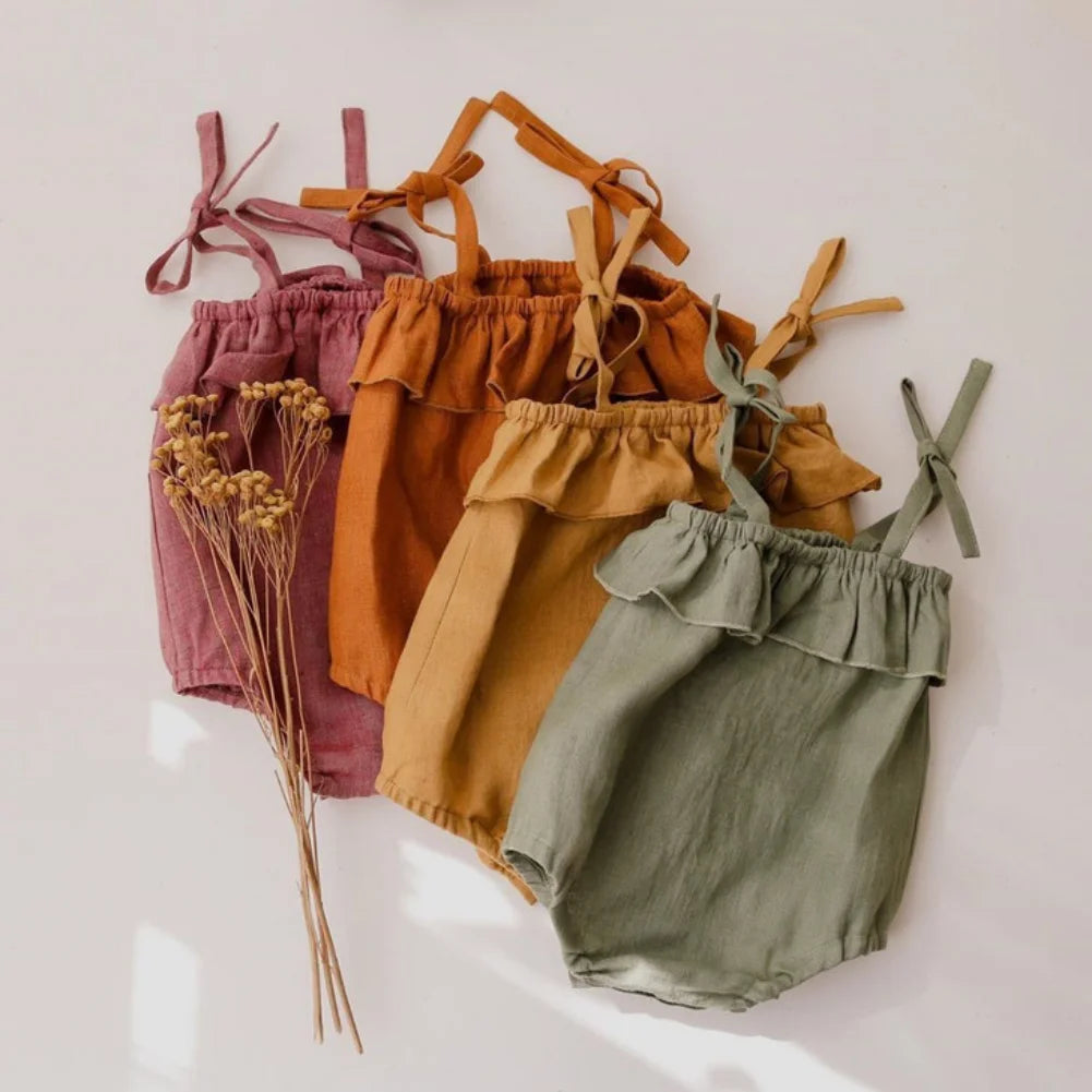 Shop the BabyLove Summer Romper at BubeBaby! A sleeveless, solid-colored romper with a ruffled bust . Made from 100% cotton, it's available for ages 0-24 months. Fits true to size and is perfect for summer. Choose the right size based on age and measurements for a comfortable fit