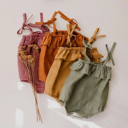 Shop the BabyLove Summer Romper at BubeBaby! A sleeveless, solid-colored romper with a ruffled bust . Made from 100% cotton, it's available for ages 0-24 months. Fits true to size and is perfect for summer. Choose the right size based on age and measurements for a comfortable fit