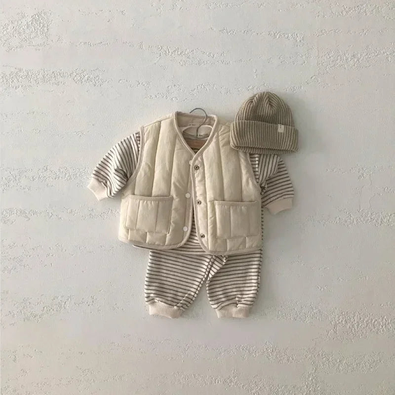 a cozy BabyLove by Bubebaby padded waistcoat, featuring soft, warm fabric and a cute design. Perfect for keeping your little one comfortable and stylish during cooler weather