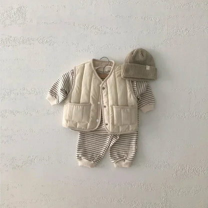 a cozy BabyLove by Bubebaby padded waistcoat, featuring soft, warm fabric and a cute design. Perfect for keeping your little one comfortable and stylish during cooler weather