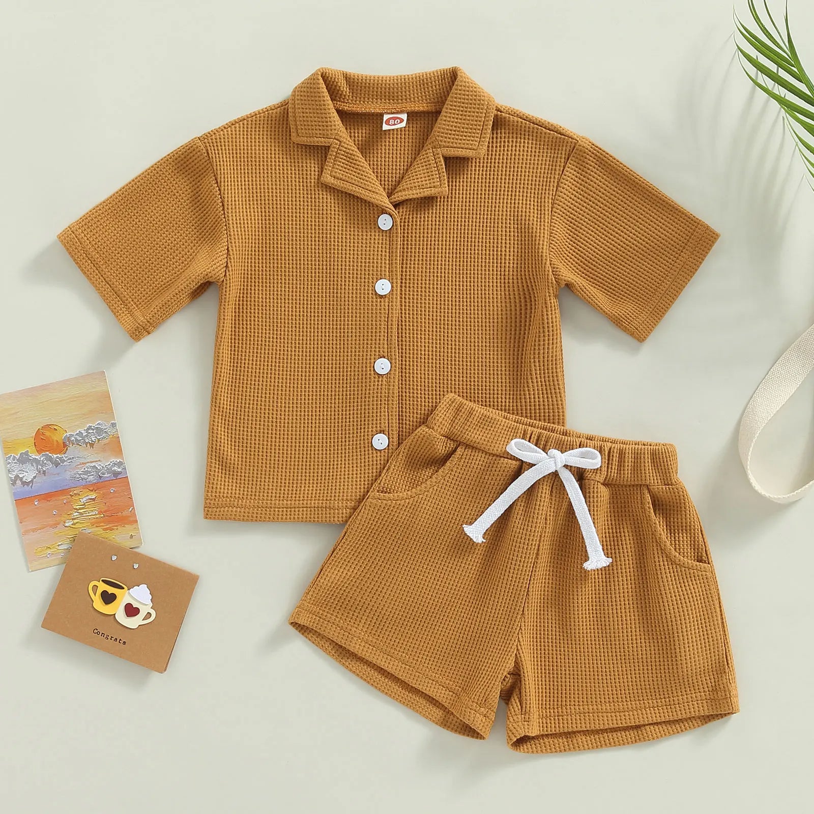 Shop our Bubebaby BabyLove summer baby unisex sets made from cotton and polyester, featuring a V-neck, single-breasted closure, and short sleeves. Available for ages 0-4 years with sizes ranging from 80-120 cm. The set includes a top and shorts with a cute print pattern, fitting true to size. Ideal for warm weather, these sets ensure comfort and style for your little ones.