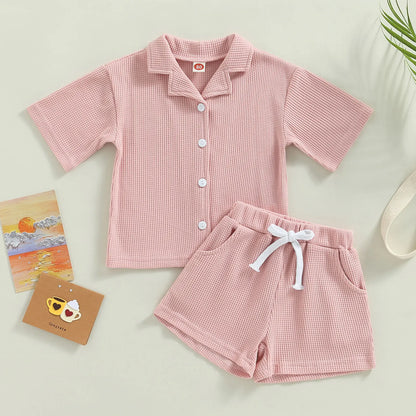 Shop our Bubebaby BabyLove summer baby unisex sets made from cotton and polyester, featuring a V-neck, single-breasted closure, and short sleeves. Available for ages 0-4 years with sizes ranging from 80-120 cm. The set includes a top and shorts with a cute print pattern, fitting true to size. Ideal for warm weather, these sets ensure comfort and style for your little ones.