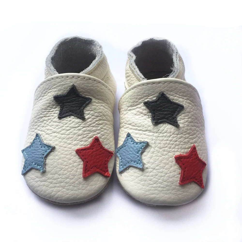 Bubebaby BabyLove Cow Leather First Walker Booties, featuring a classic design with a comfortable fit for early walkers. The booties are equipped with a flexible sole to support baby’s first steps. They come in a versatile colors, making them a stylish and practical choice for little ones