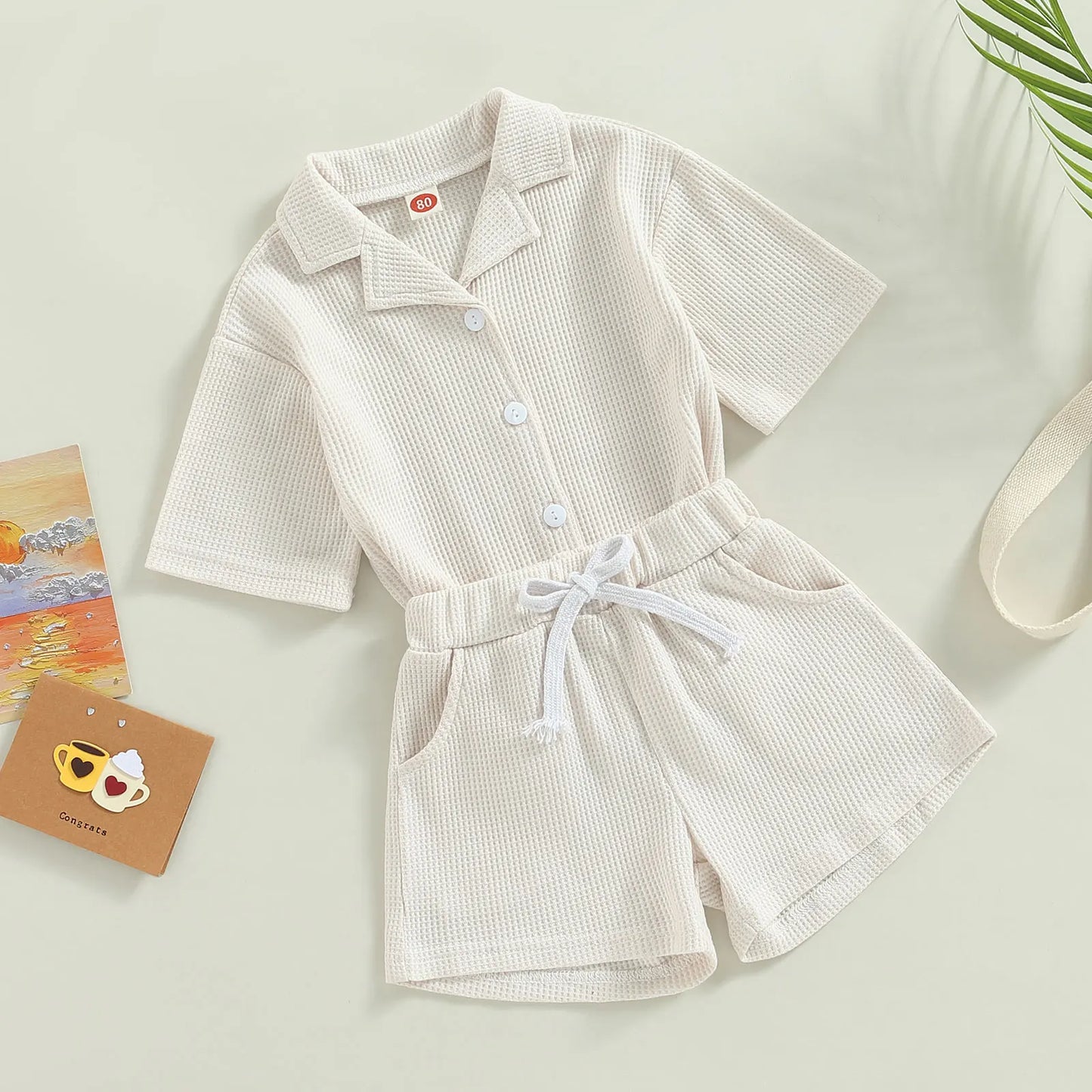 Shop our Bubebaby BabyLove summer baby unisex sets made from cotton and polyester, featuring a V-neck, single-breasted closure, and short sleeves. Available for ages 0-4 years with sizes ranging from 80-120 cm. The set includes a top and shorts with a cute print pattern, fitting true to size. Ideal for warm weather, these sets ensure comfort and style for your little ones.