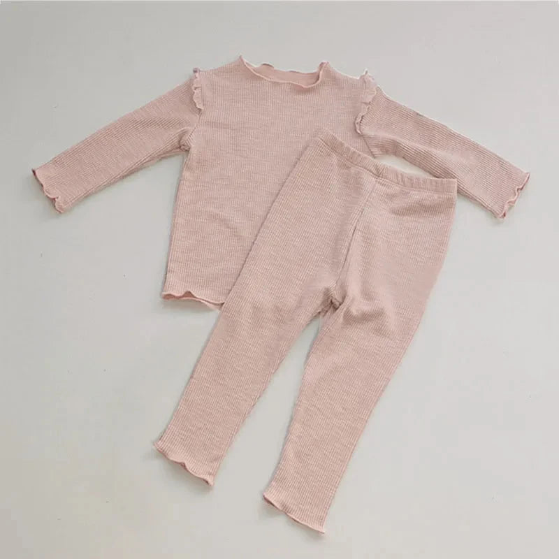 Shop the Babylove Spring Sleepwear Set at BubeBaby, featuring cozy cotton pajamas perfect for spring and autumn. Available for ages 7-12 months to 4-6 years, this unisex set includes a round-neck top and pants with a casual, printed design. Fits true to size with full sleeves and broadcloth fabric. Ideal for comfortable, stylish sleepwear