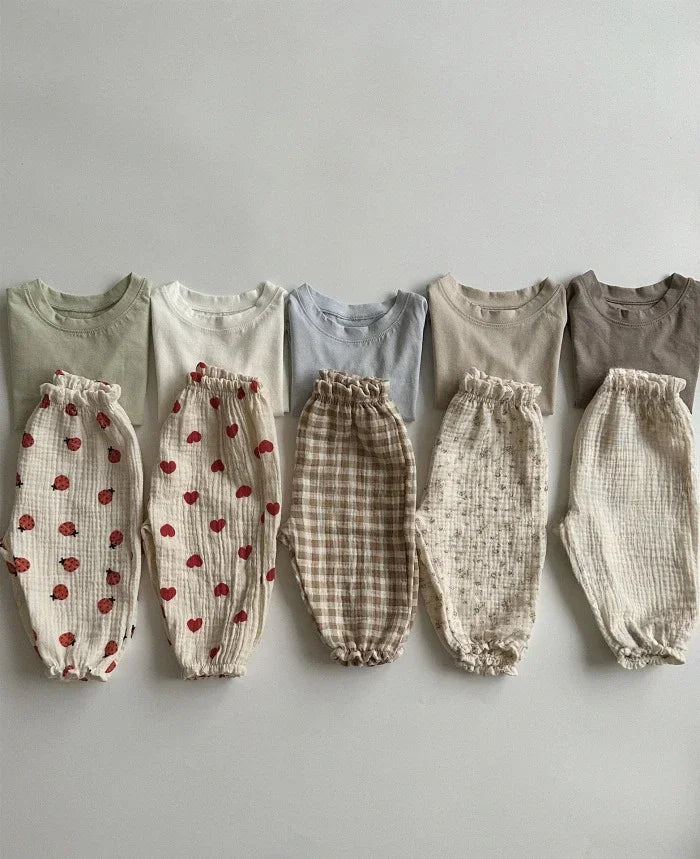 Soft muslin pants for babies from the BabyLove by Bubebaby collection. The pants are made of lightweight, breathable fabric with a gentle, stretchy waistband and a relaxed fit for comfort. The color is a soft, neutral tone, suitable for pairing with various baby tops