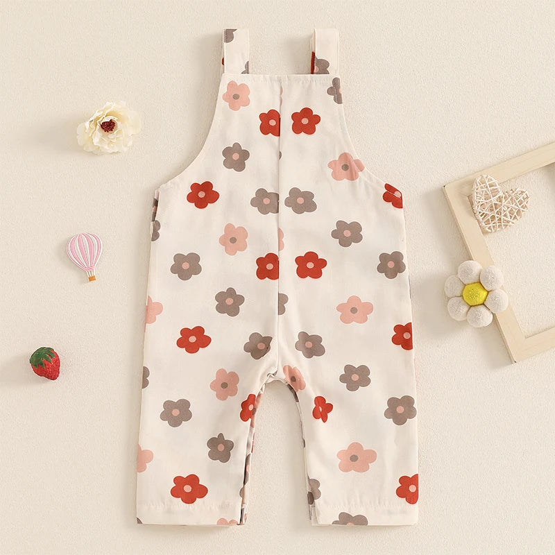 Bubebaby BabyLove Floral Jumpsuit Dungaree Romper. The romper features a floral pattern with a mix of vibrant colors. Featuring a pocket on the chest with shoulder straps, and snap closures at the bottom for easy diaper changes.