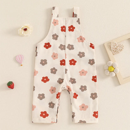 Bubebaby BabyLove Floral Jumpsuit Dungaree Romper. The romper features a floral pattern with a mix of vibrant colors. Featuring a pocket on the chest with shoulder straps, and snap closures at the bottom for easy diaper changes.