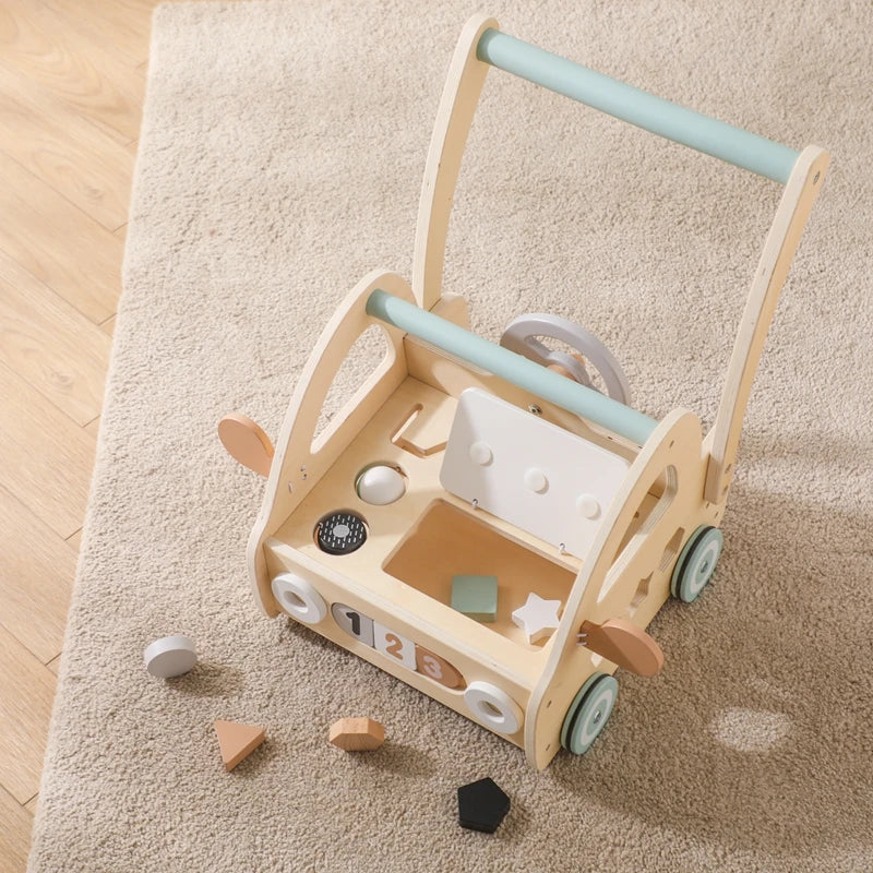 Wooden push walker from above with shape blocks on a rug