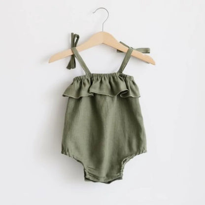 Shop the BabyLove Summer Romper at BubeBaby! A sleeveless, solid-colored romper with a ruffled bust . Made from 100% cotton, it's available for ages 0-24 months. Fits true to size and is perfect for summer. Choose the right size based on age and measurements for a comfortable fit
