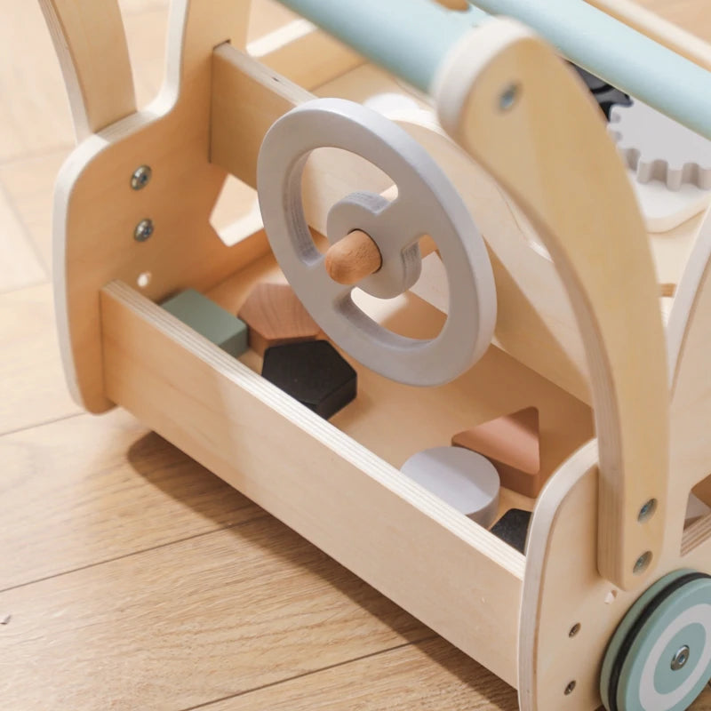 Close-up of the steering wheel and shape blocks in the walker's storage tray