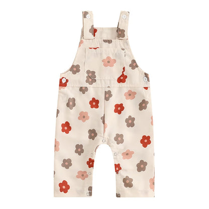 Bubebaby BabyLove Floral Jumpsuit Dungaree Romper. The romper features a floral pattern with a mix of vibrant colors. Featuring a pocket on the chest with shoulder straps, and snap closures at the bottom for easy diaper changes.