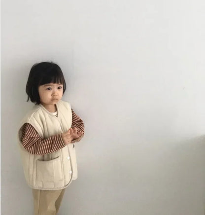 a cozy BabyLove by Bubebaby padded waistcoat, featuring soft, warm fabric and a cute design. Perfect for keeping your little one comfortable and stylish during cooler weather