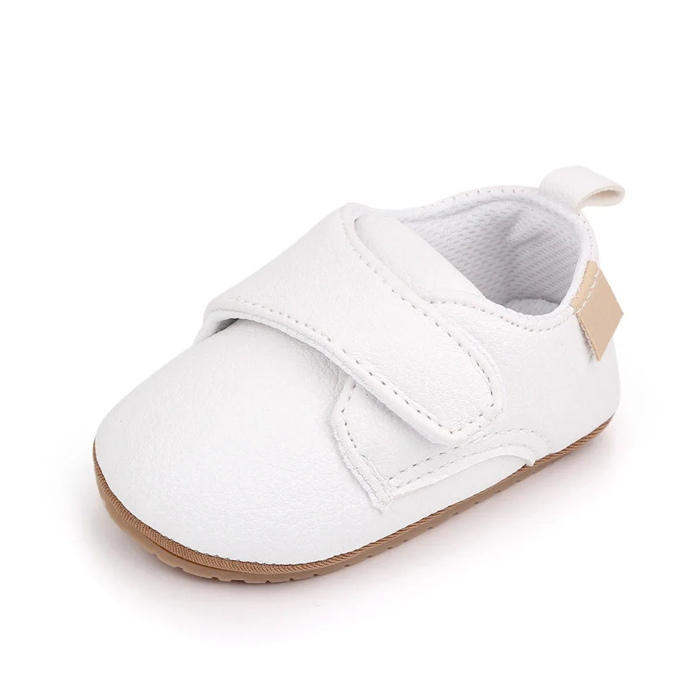 Bubebaby BabyLove faux leather dress shoes in a classic look. The shoes feature a sleek, polished design perfect for special occasions or formal wear. With a soft, cushioned interior for comfort