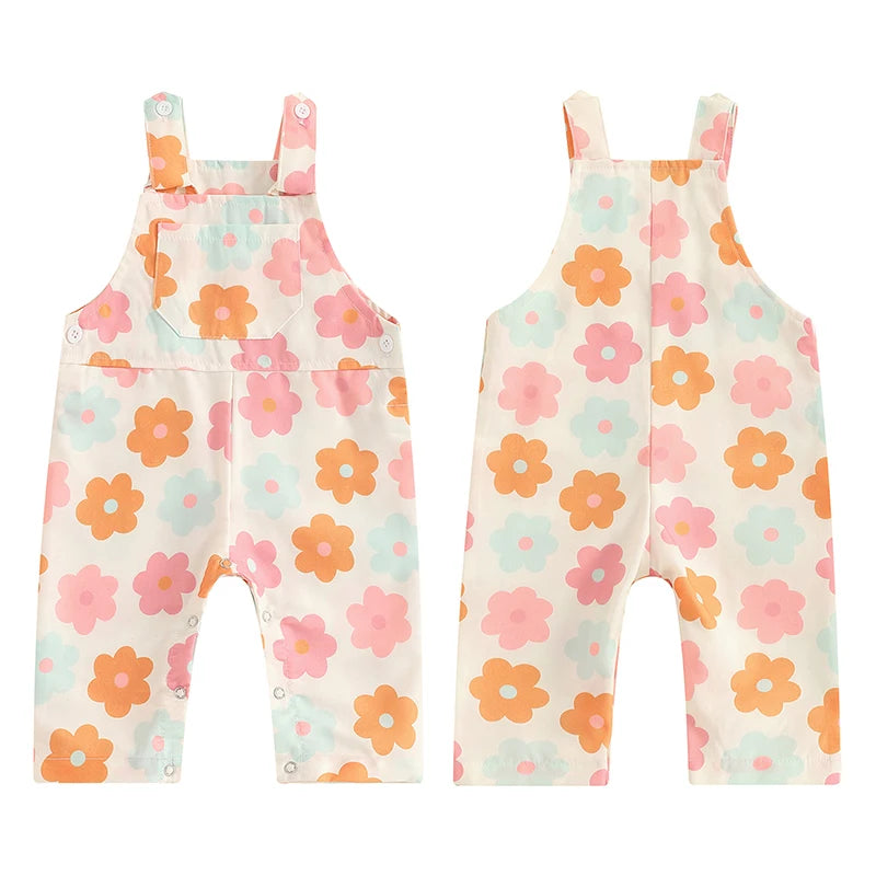 Bubebaby BabyLove Floral Jumpsuit Dungaree Romper. The romper features a floral pattern with a mix of vibrant colors. Featuring a pocket on the chest with shoulder straps, and snap closures at the bottom for easy diaper changes.