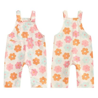 Bubebaby BabyLove Floral Jumpsuit Dungaree Romper. The romper features a floral pattern with a mix of vibrant colors. Featuring a pocket on the chest with shoulder straps, and snap closures at the bottom for easy diaper changes.