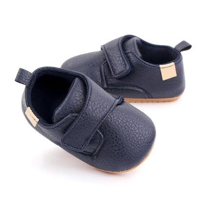 Bubebaby BabyLove faux leather dress shoes in a classic look. The shoes feature a sleek, polished design perfect for special occasions or formal wear. With a soft, cushioned interior for comfort