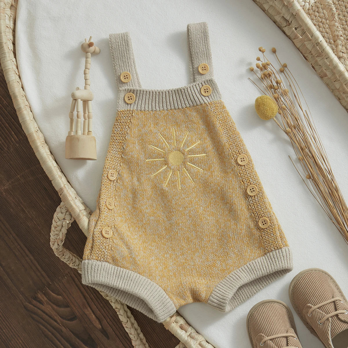  Baby unisex romper made from high-quality cotton and polyester, suitable for ages 0-24 months. The romper features a sleeveless design, straight collar, covered button closure, and a charming print pattern. Ideal for all seasons and available in various sizes to ensure a perfect fit.