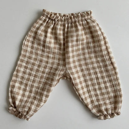Soft muslin pants for babies from the BabyLove by Bubebaby collection. The pants are made of lightweight, breathable fabric with a gentle, stretchy waistband and a relaxed fit for comfort. The color is a soft, neutral tone, suitable for pairing with various baby tops