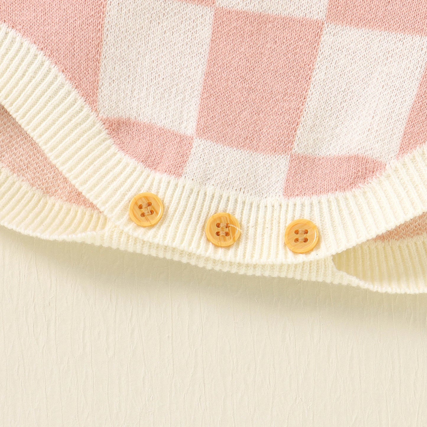 Bubebaby BabyLove unisex romper in a comfortable cotton and polyester blend, featuring a charming plaid pattern, square-neck collar, and covered button closures. Ideal for summer, available in sizes for ages 0-24 months.