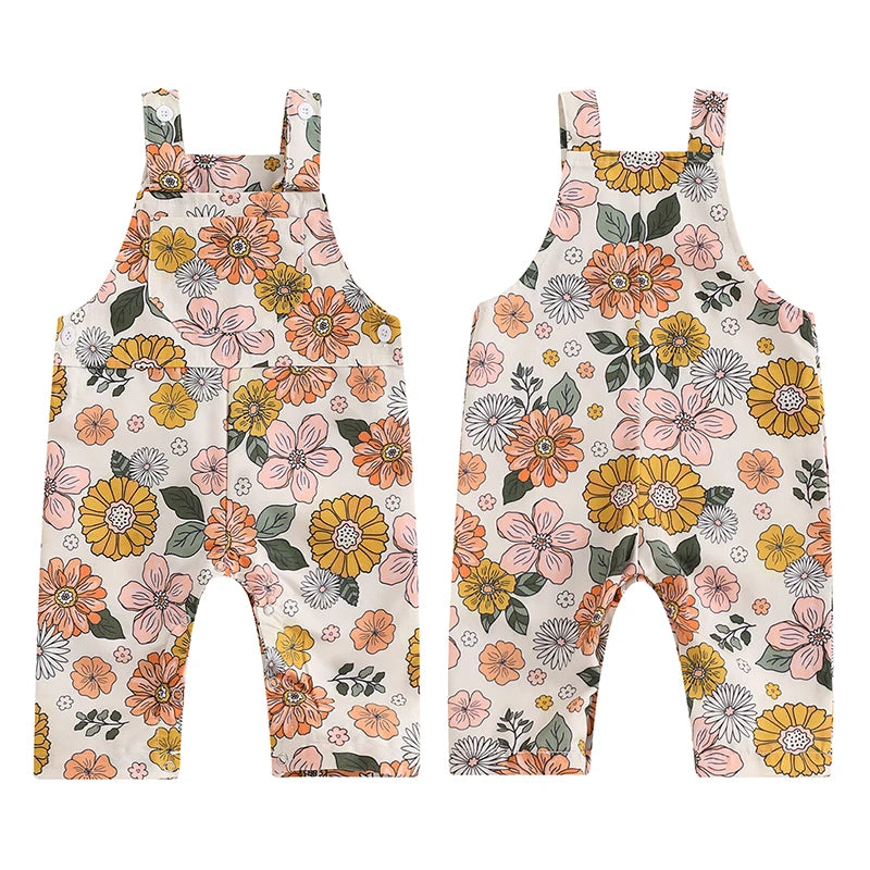 Bubebaby BabyLove Floral Jumpsuit Dungaree Romper. The romper features a floral pattern with a mix of vibrant colors. Featuring a pocket on the chest with shoulder straps, and snap closures at the bottom for easy diaper changes.