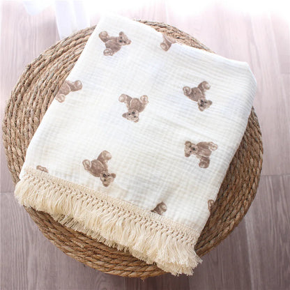 Nursery Muslin Throw Bears at BubeBaby. This unisex throw is made from soft, breathable cotton muslin, perfect for babies. Ideal for snuggling and keeping cozy, it’s designed for comfort and style. Shop now for a versatile, high-quality addition to your nursery essentials
