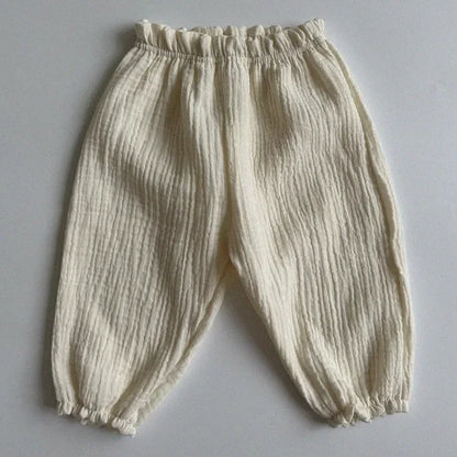 Soft muslin pants for babies from the BabyLove by Bubebaby collection. The pants are made of lightweight, breathable fabric with a gentle, stretchy waistband and a relaxed fit for comfort. The color is a soft, neutral tone, suitable for pairing with various baby tops